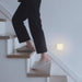 Yeelight Plug-In-Light sensor nightlight glowing softly on wall near stairs in dim lighting