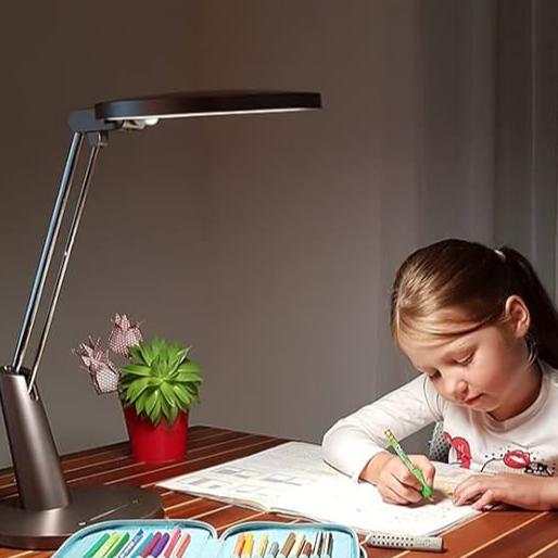 Serene Eye-Friendly desk lamp in mocca gold illuminating a child's study area with adjustable light and modern design