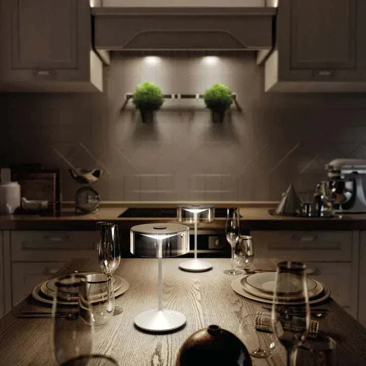 Crystal cordless table lamp with removable smoky glass shade and dimmable LED light on wooden dining table