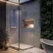 sleek modern bathroom with glass shower, illuminated display shelf and cordless lamp