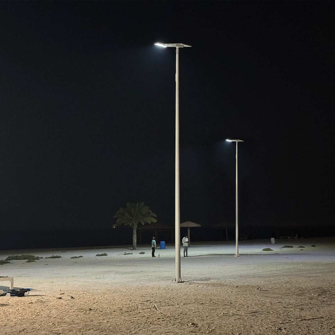 Integrated solar streetlight 120W with remote control illuminating outdoor area at night