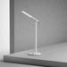 Mi LED Desk Lamp 1S modern white adjustable LED desk lamp on gray table