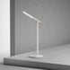 Mi LED Desk Lamp 1S modern white adjustable LED desk lamp on gray table