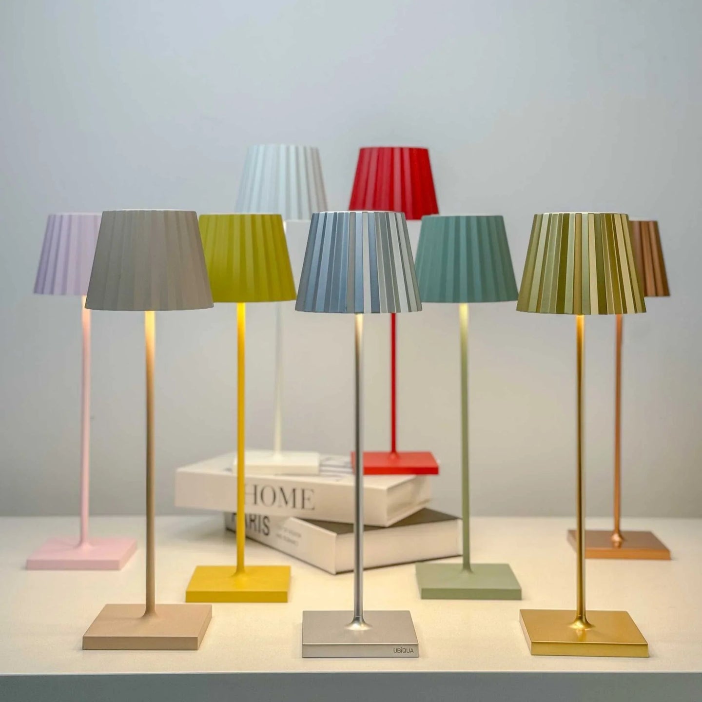 Plissé cordless LED rechargeable table lamps with colorful pleated shades and sleek modern design
