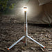 Multi-functional camping light with adjustable tripod and LED illumination outdoors at night