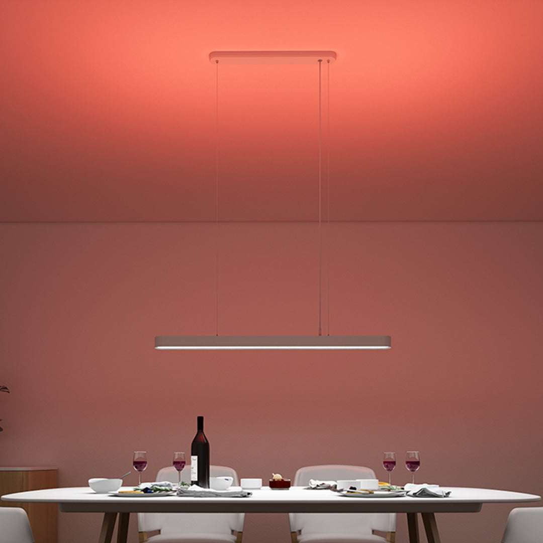 Yeelight Crystal white adjustable pendant light hanging over dining table with warm red ambient lighting