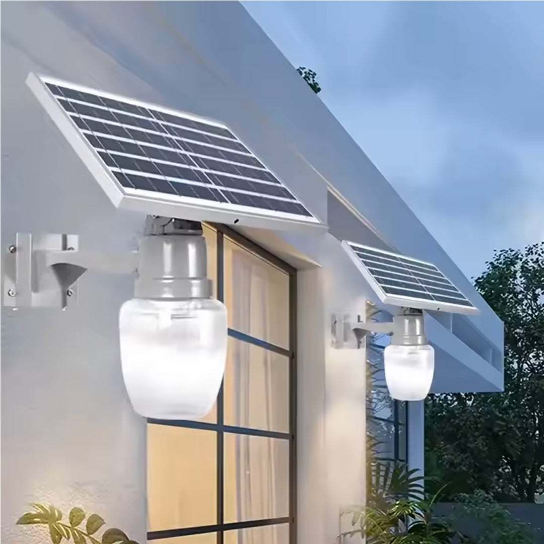 Elant Solar Golden Apple Light mounted on wall with solar panel illuminating outdoor space at dusk
