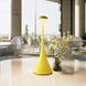 Pinup Maxi cordless rechargeable yellow LED table lamp with touch switch and dimming features on a table near flowers