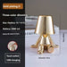 Little Golden Man Table Lamp with gold plating and three-color dimming.