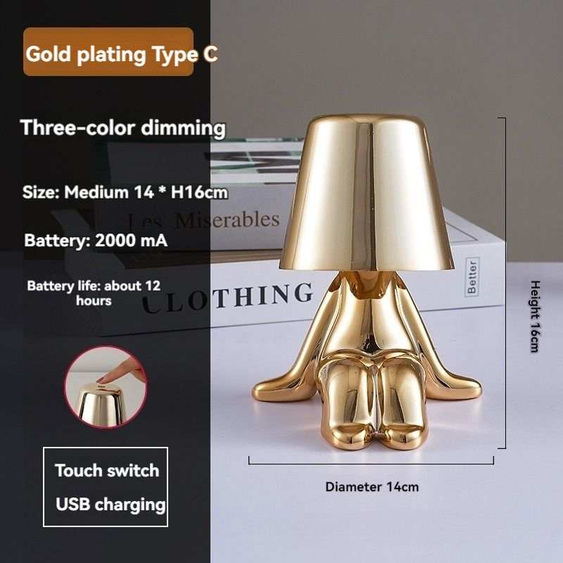 Little Golden Man Table Lamp with Oscar-like design and gold finish.