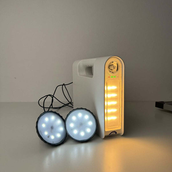 Solar rechargeable emergency lantern with dual external lamps and LED display.