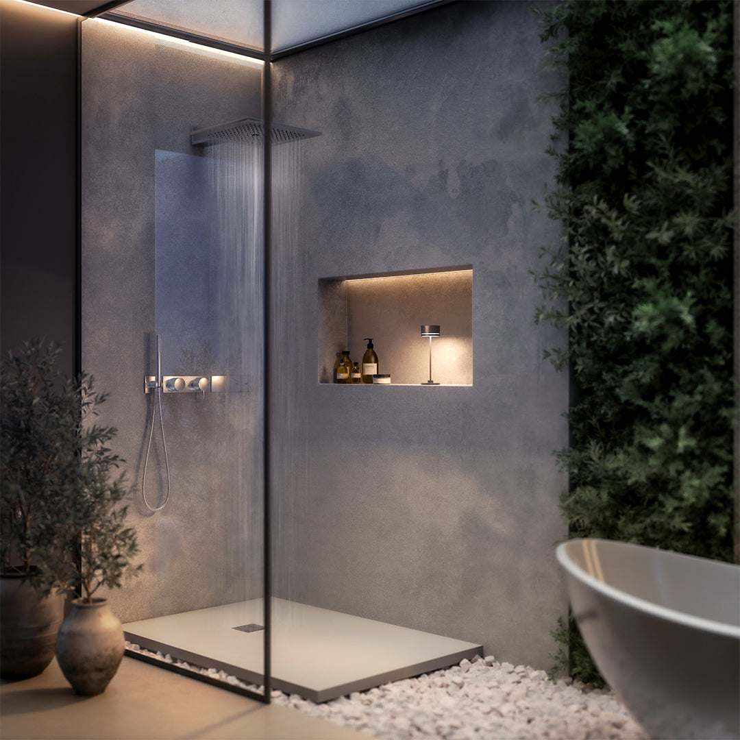 sleek modern bathroom with glass shower, illuminated display shelf and cordless lamp