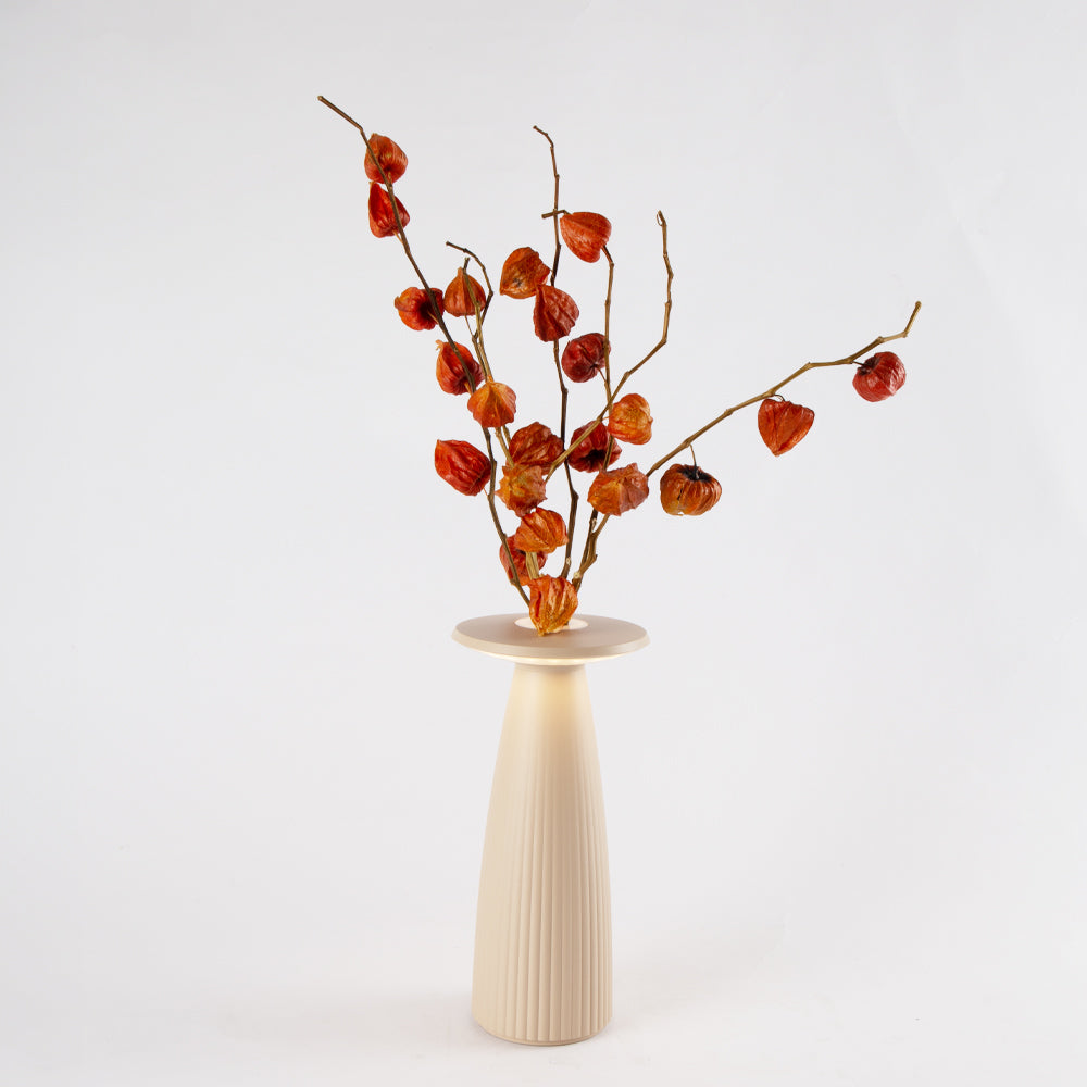 Cordless table lamp with botanical design and flowers, serving as both ambient light and vase.