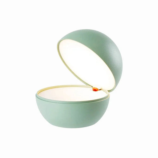 Goodnight cordless round ball-shaped rechargeable LED table lamp with dimming and mechanical switch in matte green