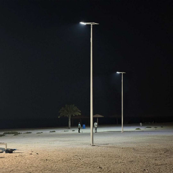 Integrated solar streetlight 120W with remote control illuminating outdoor area at night