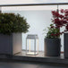 Eco-friendly Solar Handy Lantern illuminating a garden pathway with stylish design, IP54 resistance, and flexible dimming.