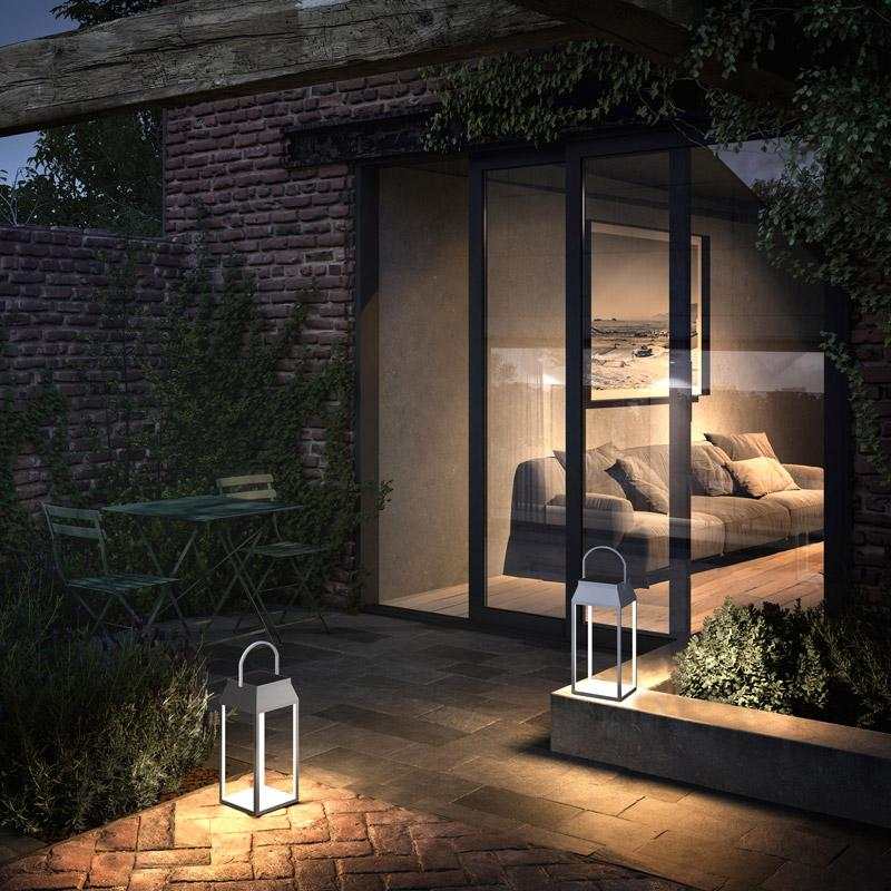 Handy Solar Rechargeable lantern illuminating outdoor patio area at night with modern design and soft warm light