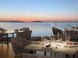 LUME Rechargeable Table Lamp on outdoor dining table at sunset.