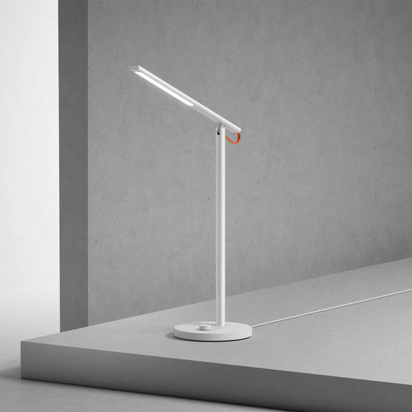 Mi LED Desk Lamp 1S modern white adjustable LED desk lamp on gray table