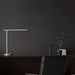 Mi LED Desk Lamp 1S on a desk with minimalist design and adjustable arm.