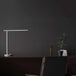 Mi LED Desk Lamp 1S on a desk with minimalist design and adjustable arm.