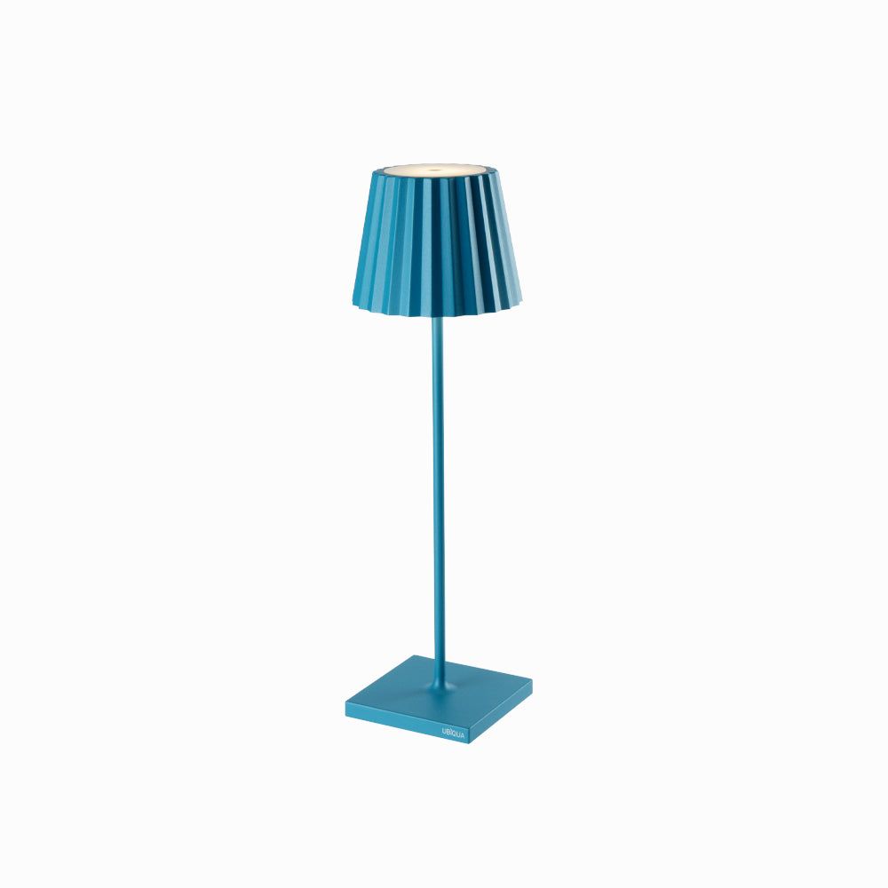 Plissé cordless table lamp with blue pleated shade and sleek design.