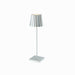 Plissé cordless table lamp with a sleek aluminum design and striped shade, ideal for versatile modern lighting.