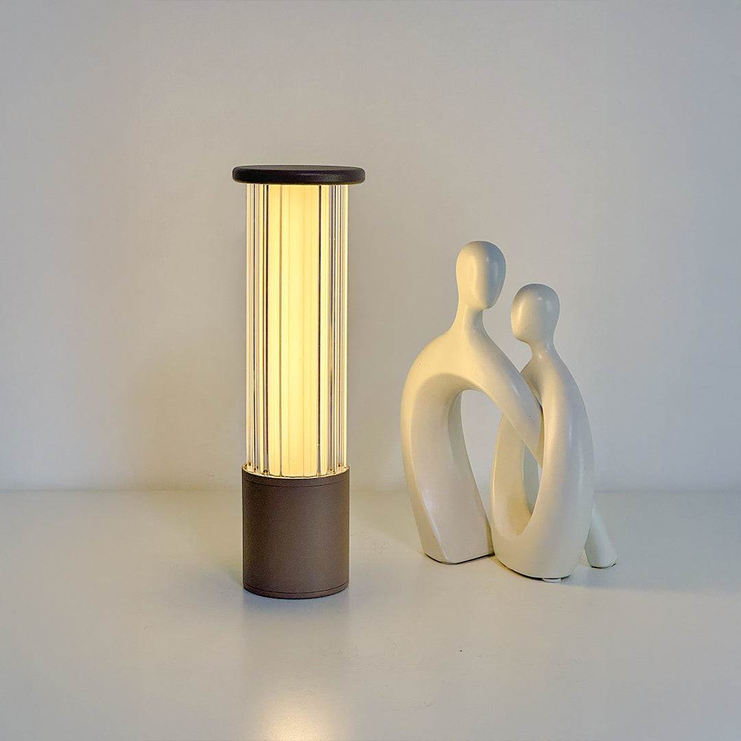 Elant Glass rechargeable table lamp glowing with modern sculpture decor
