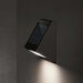 KLEWE ECOSTEP LED solar wall light in anthracite, mounted on wall, emitting light.