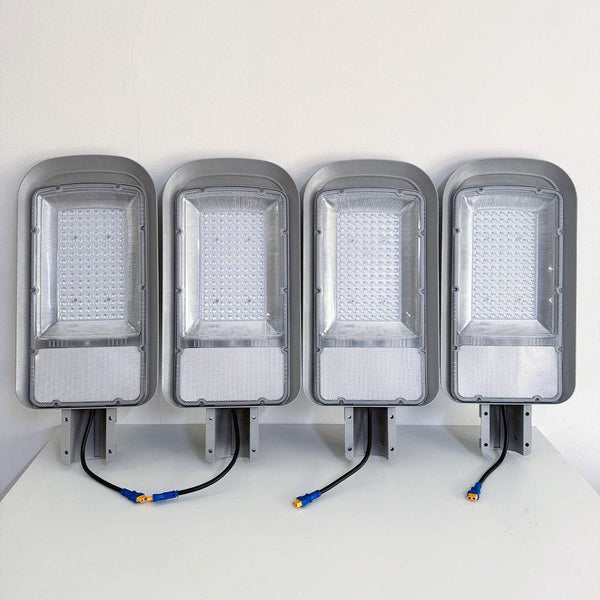 Set of four Solar Grain Street Light fixtures with LED panels and connectors, eco-friendly outdoor lighting solution.