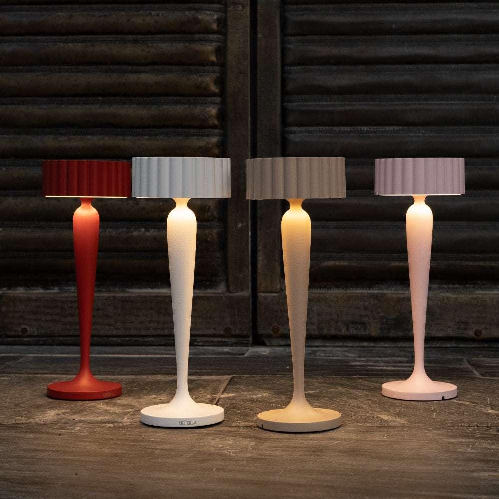 Twiggy cordless table lamps in red, white, beige, and pink with elegant curved design and soft lighting