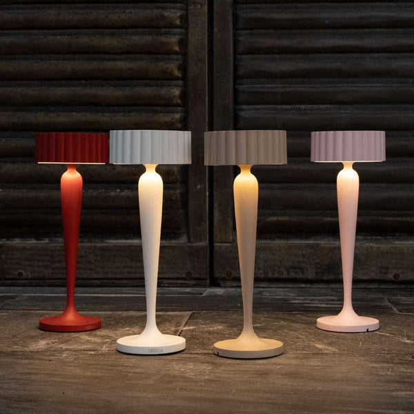 Twiggy cordless table lamps in red, white, beige, and pink with elegant curved design and soft lighting