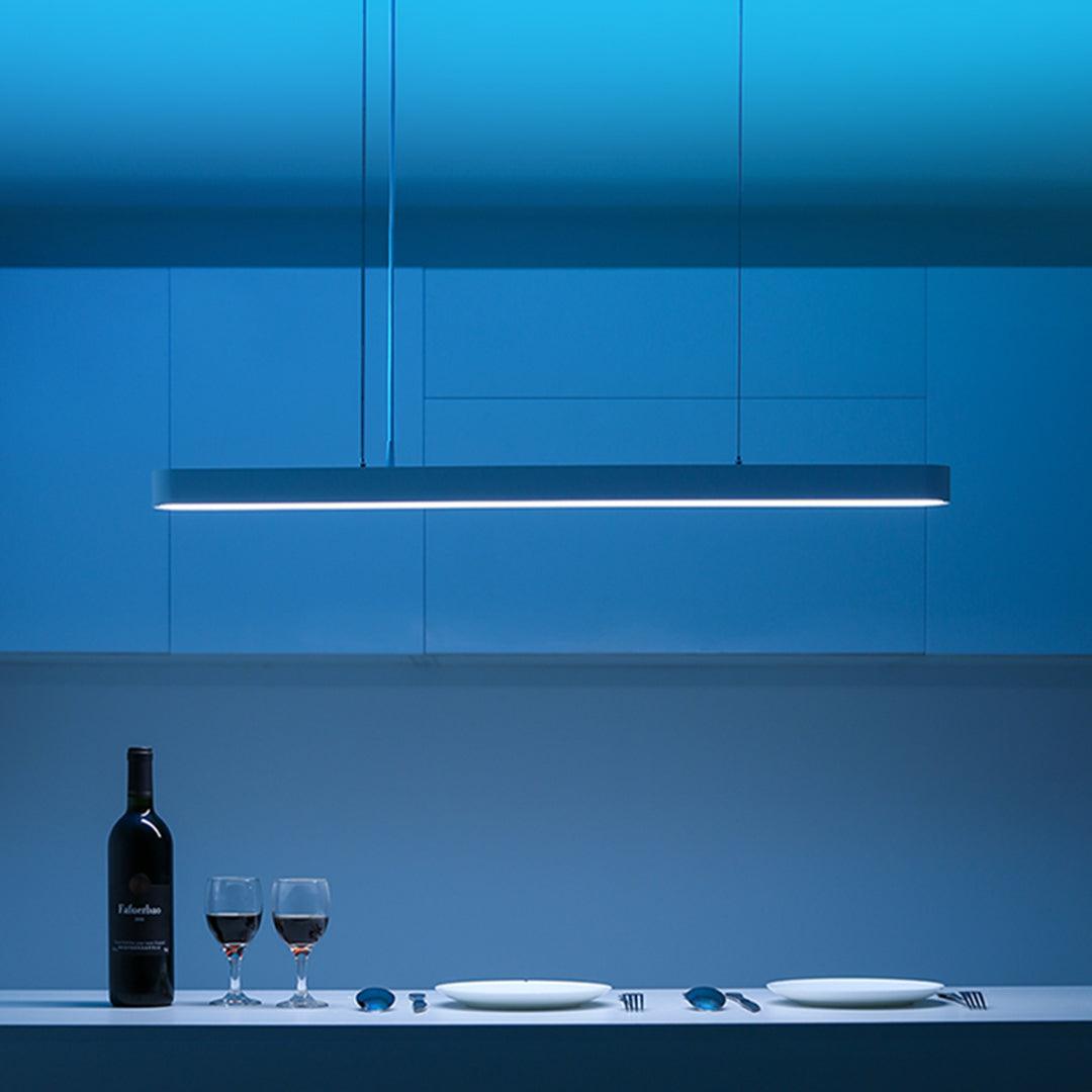Yeelight Crystal Pendant Light over dining table with blue ambient lighting.