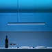 Yeelight Crystal Pendant Light over dining table with blue ambient lighting.