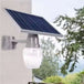 Solar Golden Apple outdoor light mounted on wall with high-efficiency solar panel.