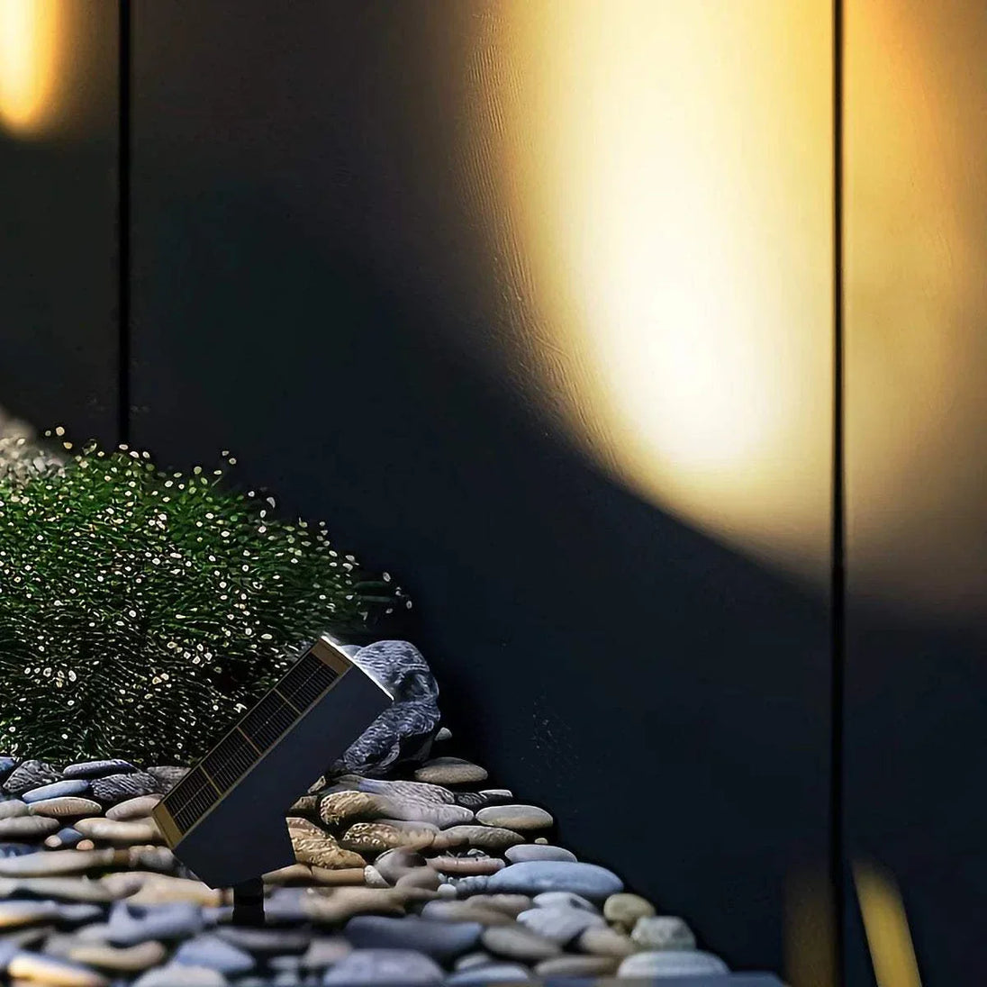 Solar LED path light with 500 lumens soft white 3000K black finish illuminating garden pathway at night