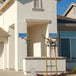 Solar Garden Light mounted on house exterior, providing eco-friendly lighting.