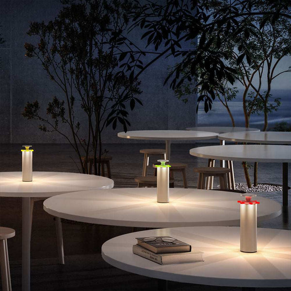 LED rechargeable table lamp Firework on round tables in outdoor night setting